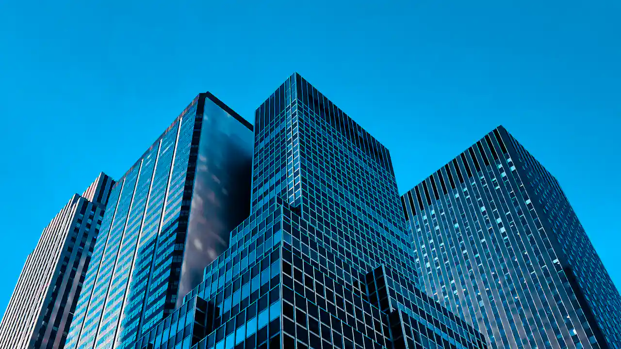 Modern office buildings against a blue sky